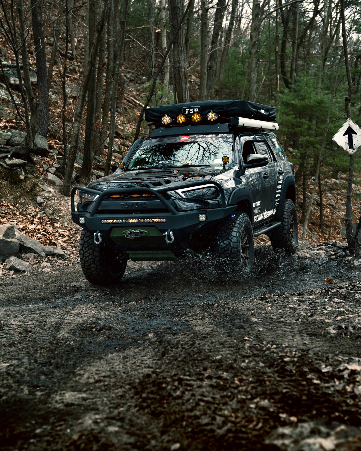 Crown Offroad truck on a wooded trail
