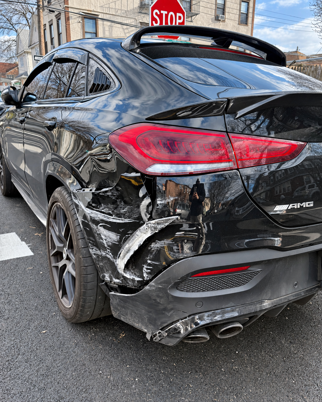 Mercedes rear-quarter and bumper collision damage before repairs